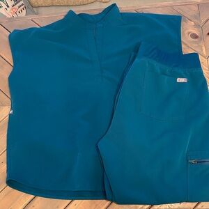 FIGS Teal Sleeveless Top and Pants Scrub Set.
